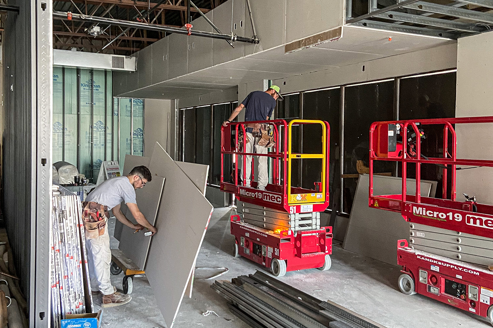 men working on modular walls